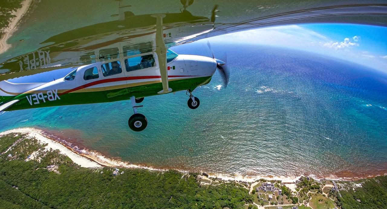 airplane rides over tulum airport